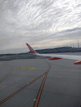 An EasyJet aircraft at Euro Airport Basel-Mulhouse is being prepared for take-off. - Theme picture - Travel photography