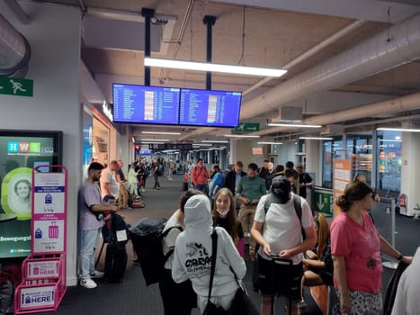 Travellers at Euro Airport Basel-Mulhouse wait for customs control and clearance