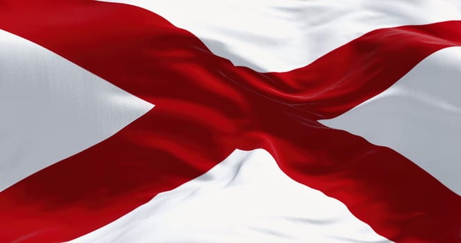 Close up of the Alabama state flag waving in the wind. Alabama is a state in the Southeastern region of the United States. Democracy and independence. American state.