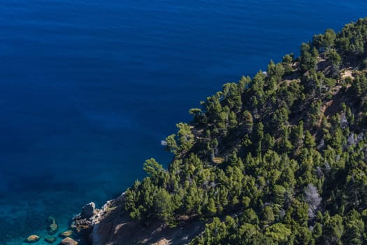 Sea waves and rocks on the steep west coast of Mallorca.