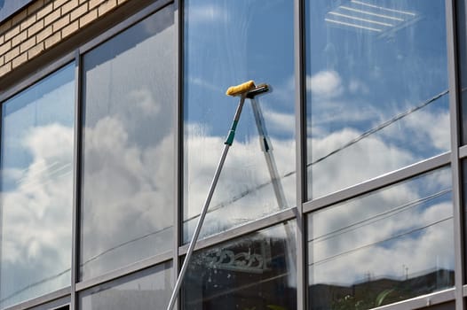 window washing, washing a street shop window. High quality photo