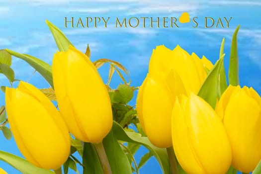 Mothers day greeting card. Decorative composition of a bunch of yellow tulips over abstract blue cloudy sky background with Happy mother's Day text.