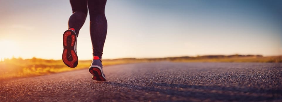 Woman running outdoors on the evening sunset. Concept of healthy lifestyle.