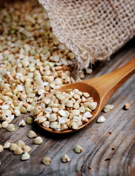 Closeup of buckwheat in wooden spoon