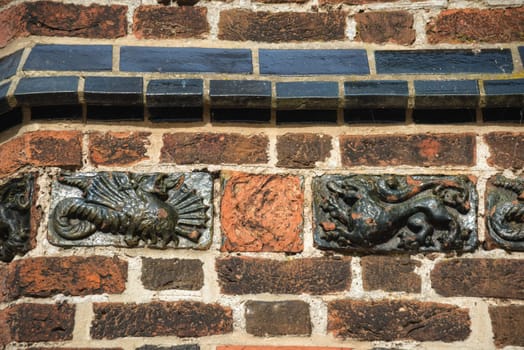 Ornamental tiles at the brick wall of a church at wismar