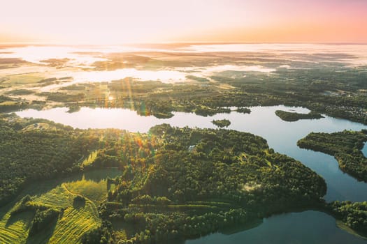 Lyepyel District, Vitebsk Region, Belarus. Aerial View Of Sunset Sunrise Above Residential Area With Houses In Countryside. Morning Fog Above Lepel Lake. Bird's Eye View Of Lepel Lake.