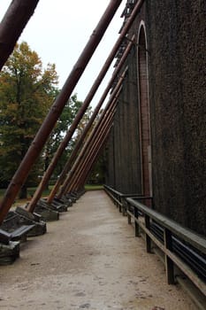 A graduation tower (occasionally referred to as a thorn house is a structure used in the production of salt which removes water from a saline solution by evaporation, increasing its concentration of mineral salts.Ein Gradierwerk (auch Leckwerk) ist eine Anlage zur Salzgewinnung. Sie besteht aus einem Holzgerüst, das mit Reisigbündeln (vorwiegend Schwarzdorn) verfüllt ist