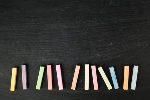 Chalkboard with colorful chalk, copy space for text , back to school, education concept