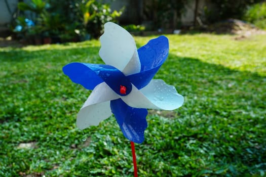 Rotating colorful pinwheel outdoor shot retro colors.