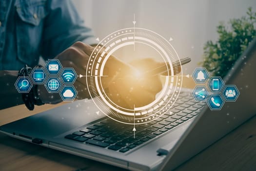 Casual Businessman Touching Smart Phone or Mobile Phone Screen by Finger on Laptop Computer and Blue HUD Social Communication Sign Search Icon,Position Pin,Wifi,Cloud in Vintage Tone