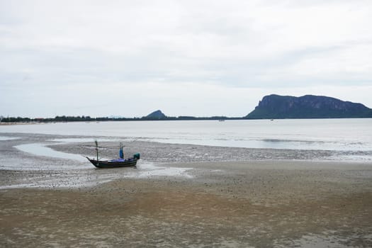 Summer beach along the coast during low tide. Prachuap Khiri Khan Province, Thailand.