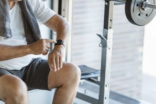Active and healthy senior exercising in a gym