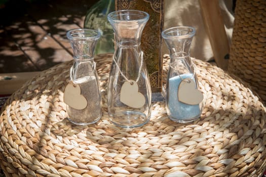 Wedding Sand Ceremony set. Objects placed on rattan cushion