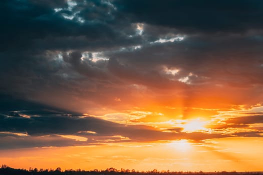 Sun Shine During Sunset Above Empty Spring Countryside Rural Soil Landscape. Field Under Sunny Spring Sky. Agricultural Landscape With Copy Space.