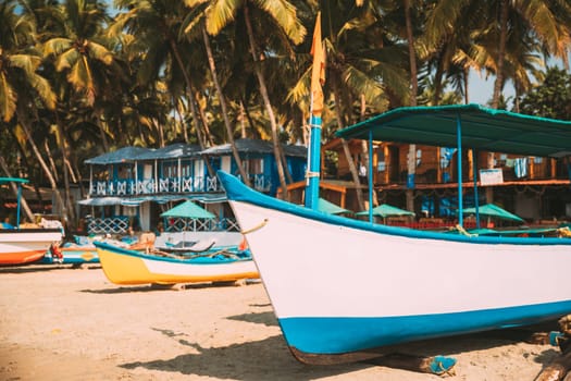 Canacona, Goa, India. Sightseeing Tourist Boat Parked On Famous Palolem Beach In Summer Sunny Day.
