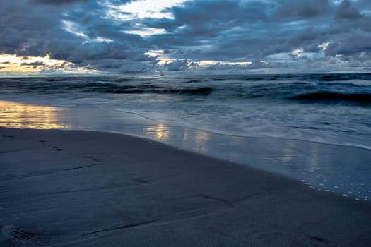 Sunset over Baltic Sea with oil platform in background  - Lubiatowo, Pomerania, Poland