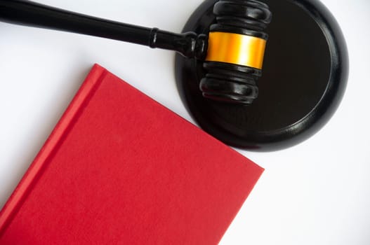 Red cover book and gavel with space customizable for text or ideas. Copy space