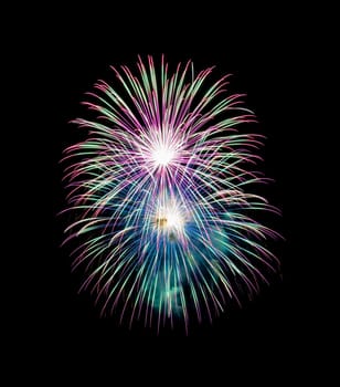 Night colorful fireworks on black background. Beautiful lights for celebration.