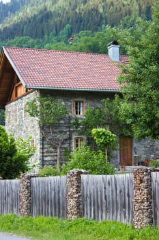 A traditional stone house in the alpine village of Doelsach, East Tyrol, Austria