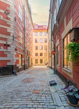 Narrow alley located in Gamla stan, the old town of Stockholm, Sweden with old style colorful houses and cobblestone street, Stockholm, Sweden