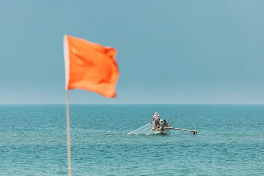 Arossim, Goa, India. Fishermen In Boat Sailing Sea And Fishing By Net.