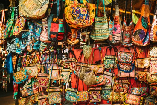 Goa, India. Traditional Store Market With Hand-sewn Bags Different Colors And Sizes. Popular Souvenirs From India.