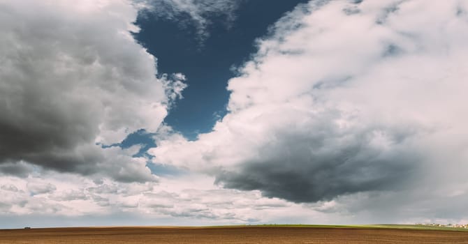 Countryside Rural Field Landscape With Empty Brown Soil. Early Spring Agricultural Season.
