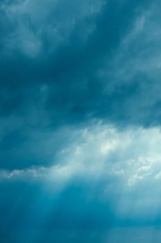 Sunrays Through Blue Rainy Dramatic Sky. Natural Abstract Background.