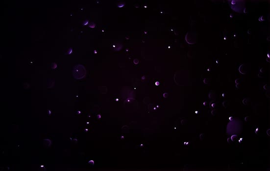 Light abstract dark bokeh christmas circle color glitter blurred black background