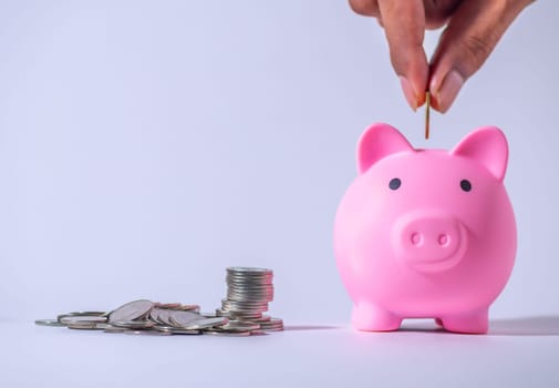Save money and account banking for finance concept, Piggy bank with coin on blurred background, Save Monney for Investors Using Internet to Trade Stocks or Trade Fund