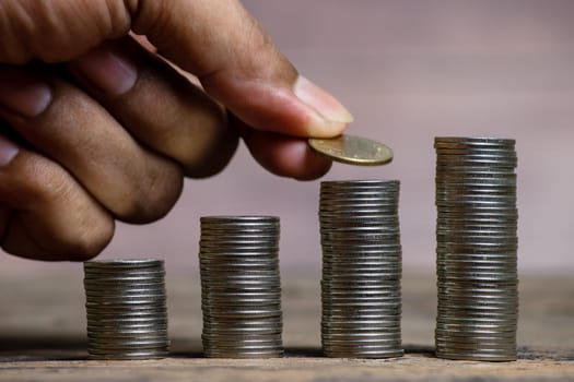 Save money and account banking for finance concept, Hand bank with coin on blurred background, Save Monney for Investors Using Internet to Trade Stocks or Trade Fund