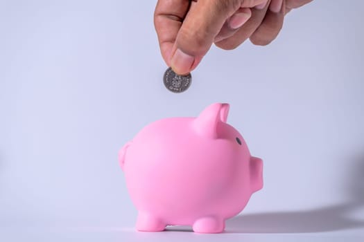 Save money and account banking for finance concept, Piggy bank with coin on blurred background, Save Monney for Investors Using Internet to Trade Stocks or Trade Fund