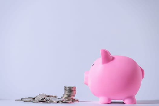 Save money and account banking for finance concept, Piggy bank with coin on blurred background, Save Monney for Investors Using Internet to Trade Stocks or Trade Fund