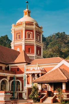 Kavlem, Phonda, Goa, India. Shree Shantadurga Mandir, Kavlem Temple. Famous Landmark And Popular Destination. White Lamp Tower. Shantadurga Devi.