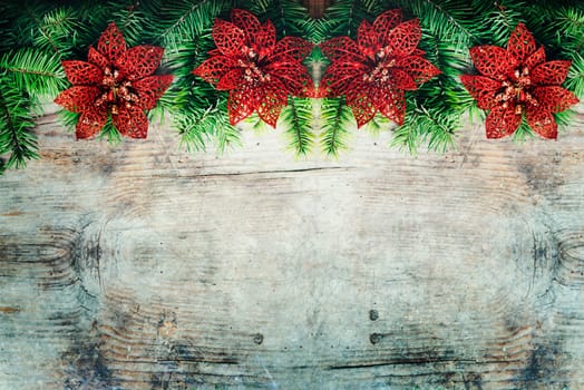 Top view of fir tree branches and decoration border. Christmas holiday and new year decorative wooden grunge textured background design with copyspace.