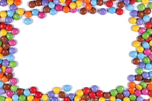 A multi coloured halloween candy sweet border on white
