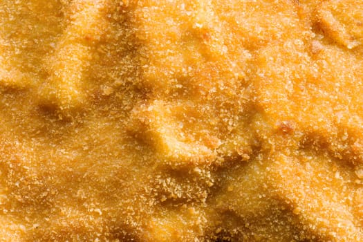 close up of golden breaded german schnitzel food background