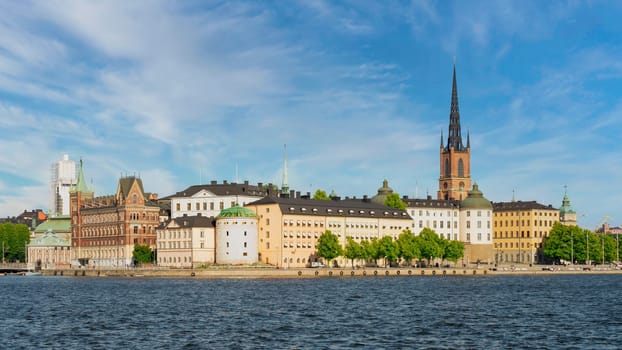 Stockholm, Sweden - June 25 2022: View from City Hall overlooking Riddarholmshamnen Island, with Norstedt Building, Birger Jarl's Tower, Supreme Administrative Court, and Riddarholmen Church tower
