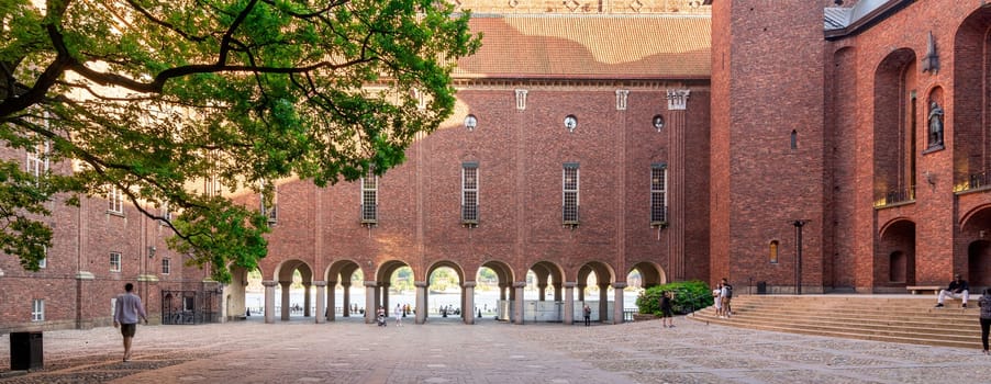 Stockholm, Sweden - June 25 2022: Stockholm City Hall, Stadshuset, on the eastern tip of Kungsholmen island, next to Riddarfjarden's northern shore and facing the islands of Riddarholmen and Sodermalm