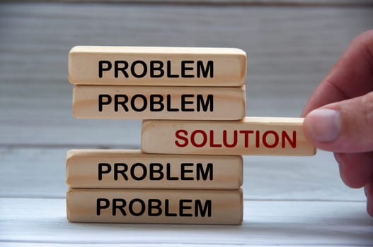 Problem and solution text on wooden blocks. Solution concept