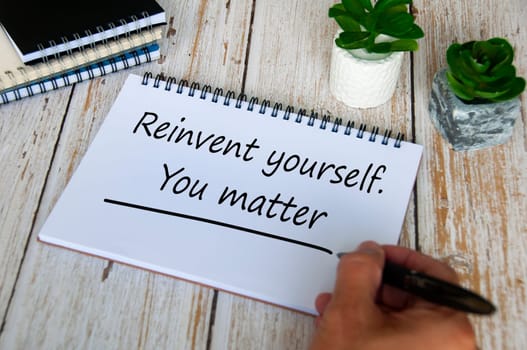 Reinvent yourself. You matter text on notepad. Motivational and inspirational concept.