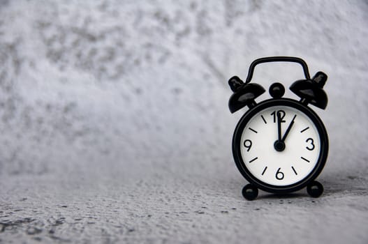 Alarm clock pointing at 1 o'clock with customizable space for ideas or text. Copy space and time concept