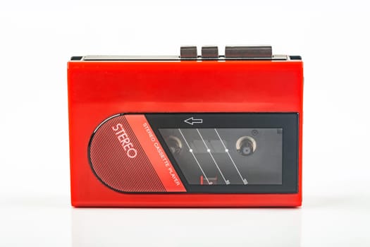 Beautiful red vintage audio cassette player over white background