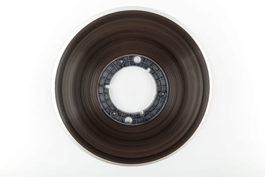 Side view of a large tape reel isolated over white background
