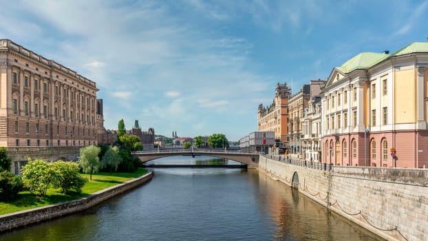 Norrstrom River, with Utrikesdepartementet, or Ministry for Foreign Affairs on the right, and Riksdagshuset, the Swedish Parliament House on the left, Gamla Stan, or Old town, Stockholm, Sweden
