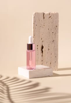 Dropper Bottle on travertine stone near white orchid flowers and palm leaf shadow on light yellow, close up, mockup. Skincare beauty product, essential oil or serum. Exotic cosmetics, pastel minimal composition..