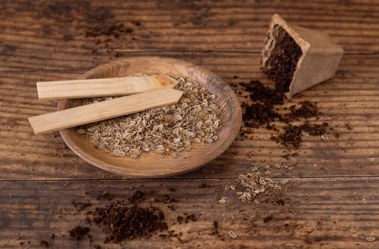 Dill Herbs seeds and biodegradable pot on wooden table close up. Urban Indoor gardening, homegrown plants, germination at home