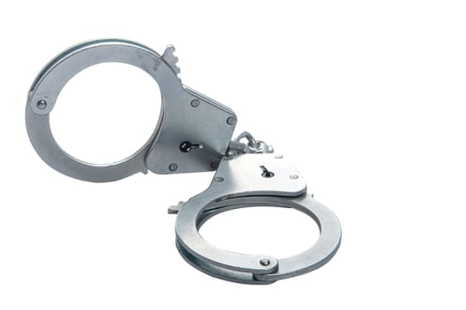 Metal handcuffs on a white isolated background, copy space. High quality photo