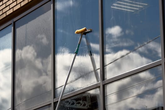 window washing, washing a street shop window. High quality photo