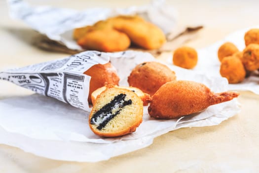Finger food and street food - fried curd balls filled with Oreo cookies